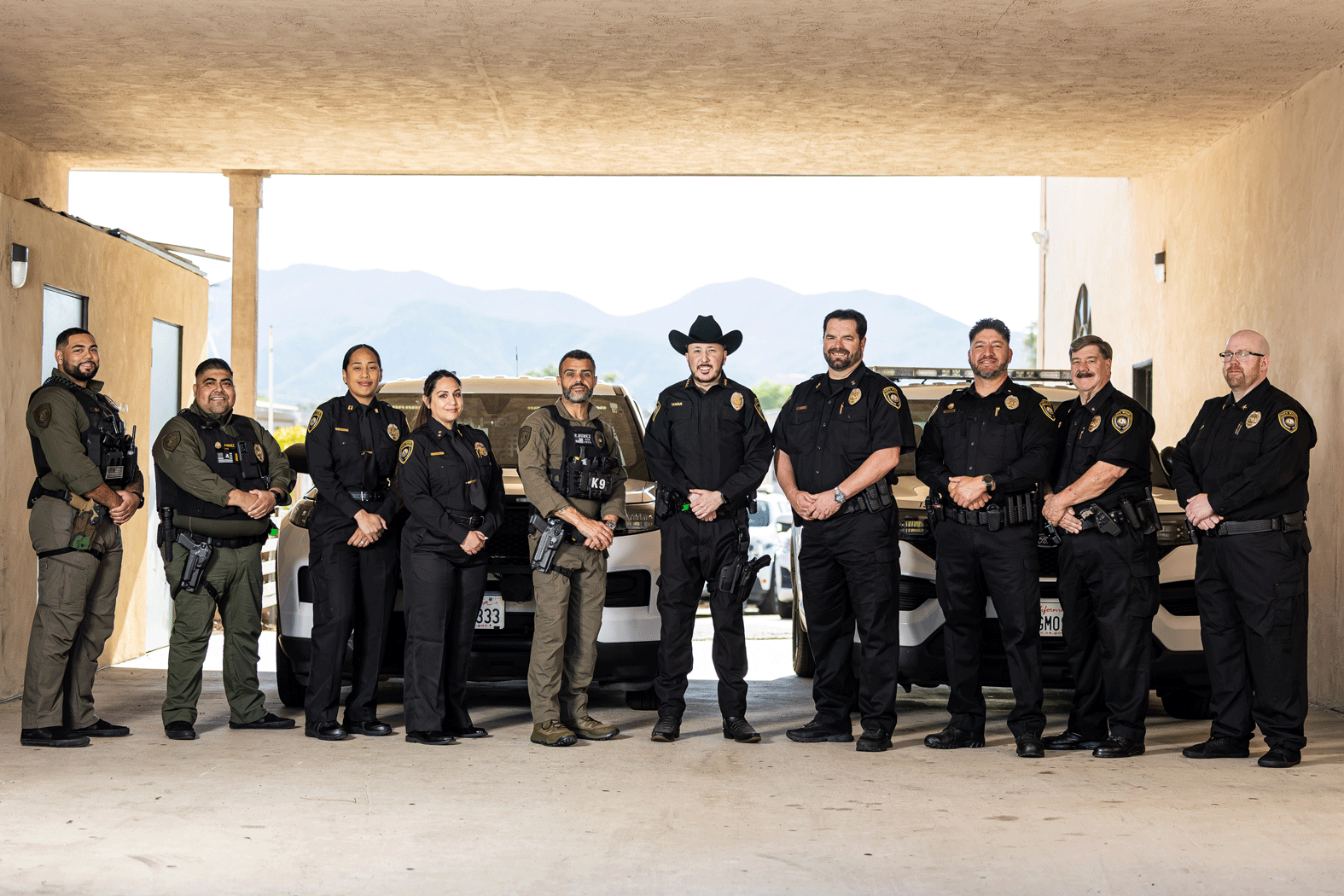 City Wide Protection Services officers standing in front of their patrol vehicles